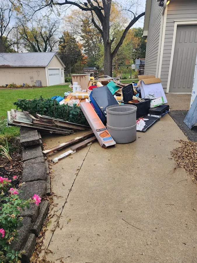 Dumpster being loaded with debris for Roofing Dumpster Rental in Guymon